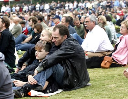 Jason, Eleanor, and Andrew listening to the Dalai Lama